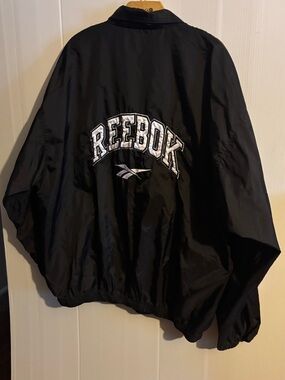vintage 1990s Reebok spell-out nylon windbreaker jacket
